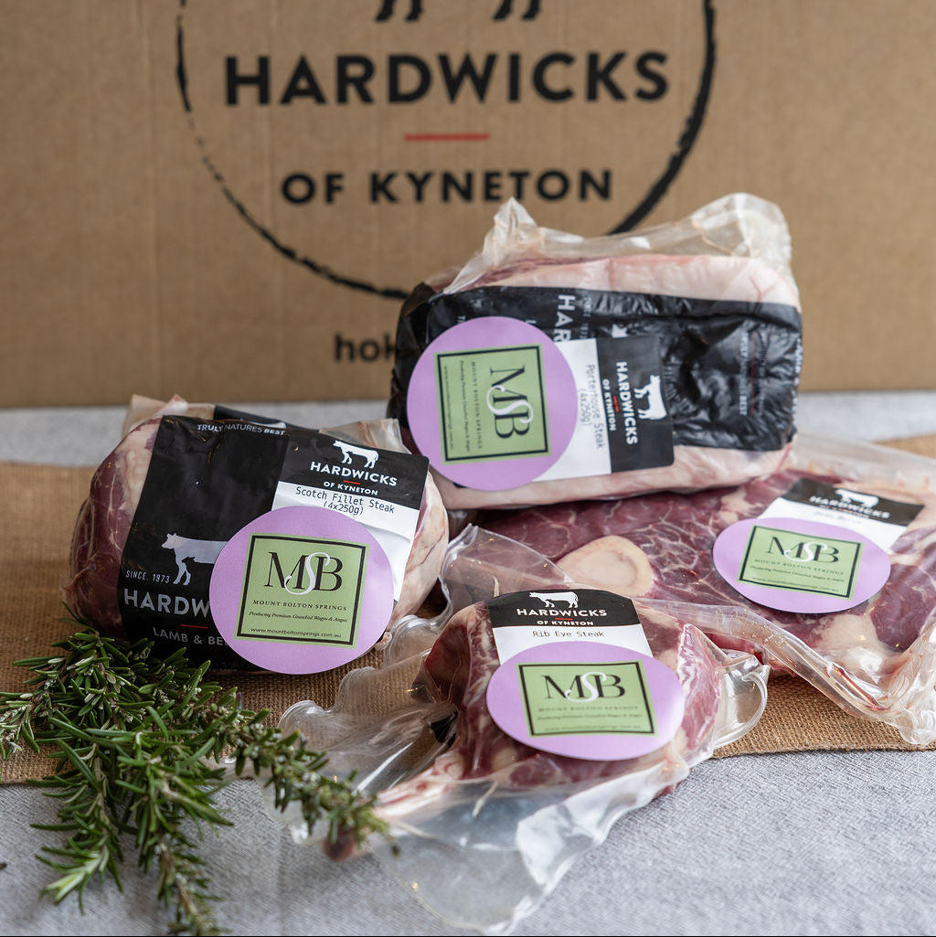 Mount Bolton Springs wagyu packaged meat products with butcher partner Hardwicks of Kyneton branding on a cardboard box background.