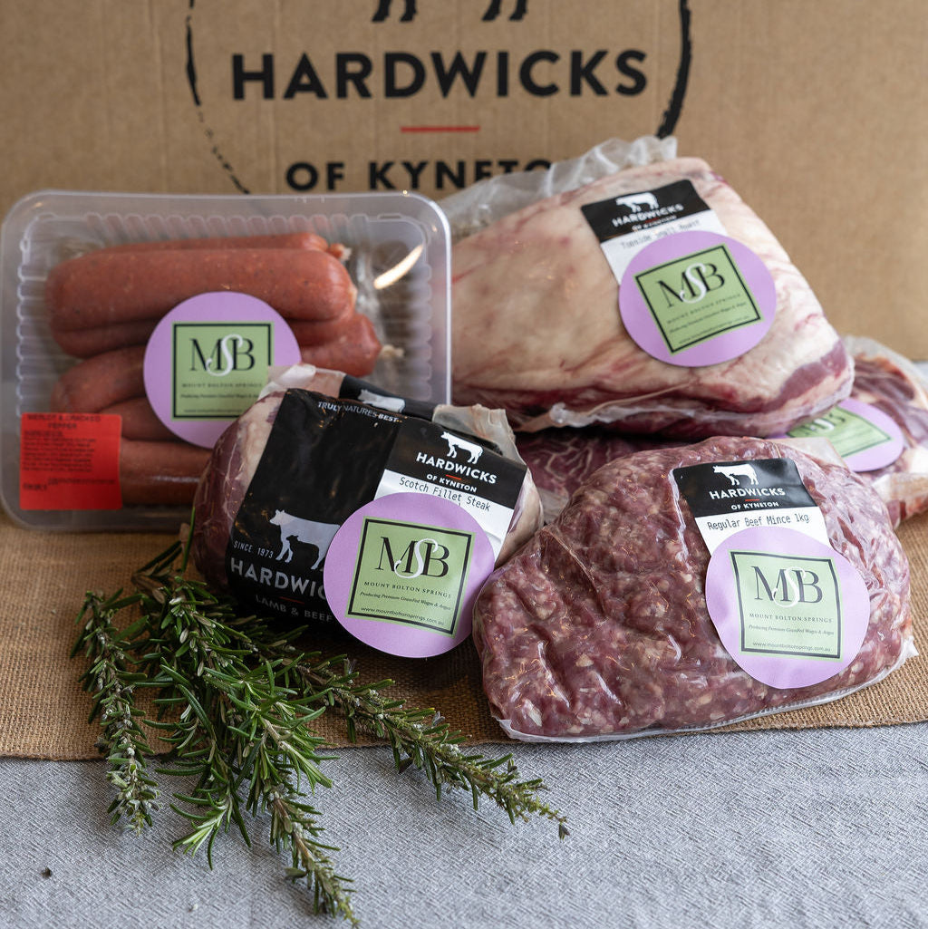 Mount Bolton Springs Wagyu packaged meats with butcher partner Hardwicks of Kyneton branding on a cardboard box background.