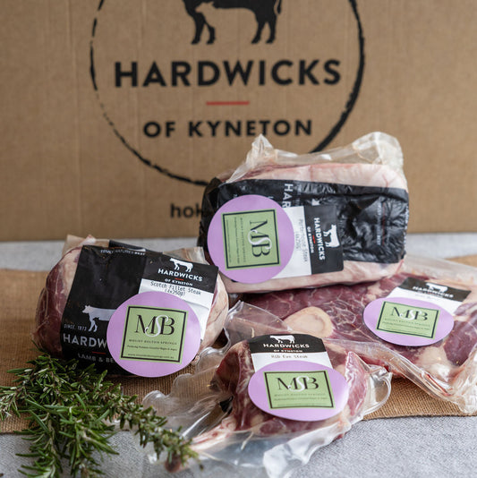 Mount Bolton Springs Wagyu packaged meat products with butchery partners, Hardwicks of Kyneton branding on a cardboard box background.